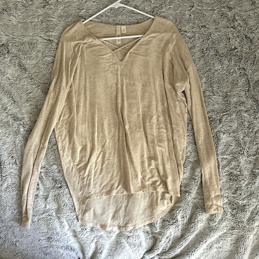 Tunic style long sleeve, v neck with a cross detail